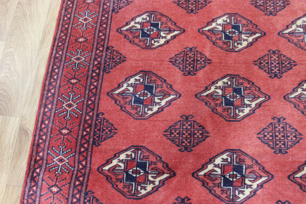 Vintage handmade Bokhara Turkmen wool rug of traditional large gul design 157 x 115 cm