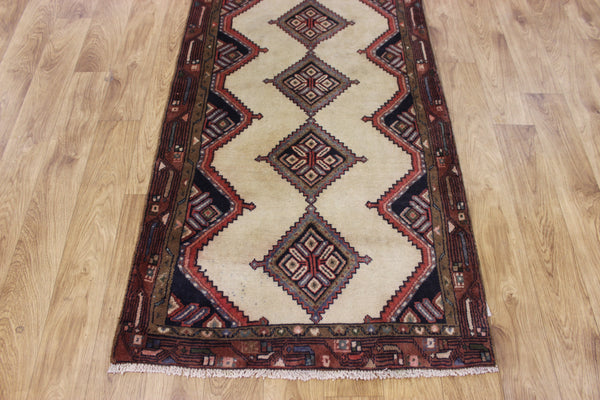 An outstanding handmade Persian runner of traditional medallion design 270 x 70 cm