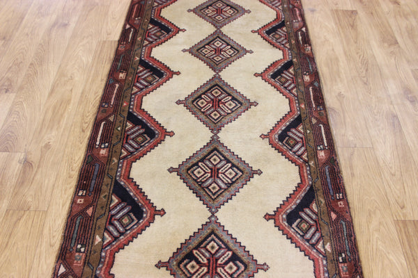 An outstanding handmade Persian runner of traditional medallion design 270 x 70 cm