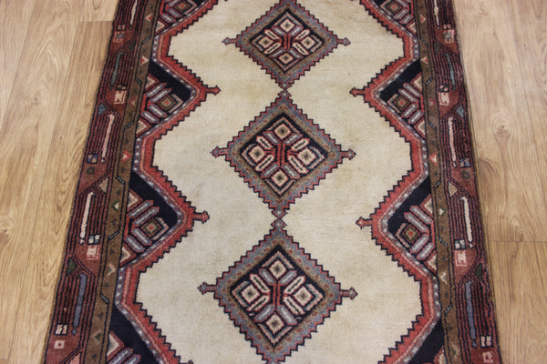 An outstanding handmade Persian runner of traditional medallion design 270 x 70 cm