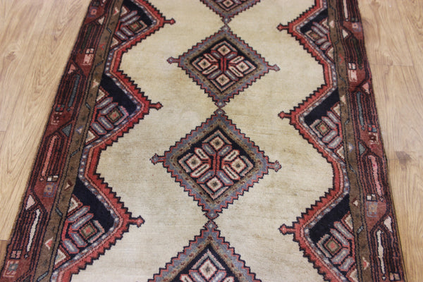 An outstanding handmade Persian runner of traditional medallion design 270 x 70 cm