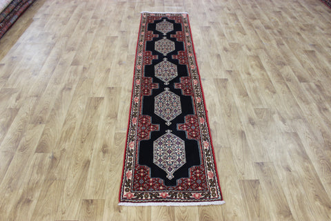 A traditional Persian Bidjar runner of traditional medallion design 247 x 56 cm