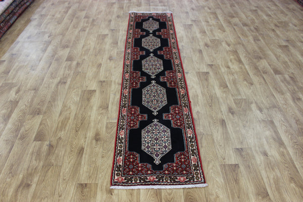 A traditional Persian Bidjar runner of traditional medallion design 247 x 56 cm