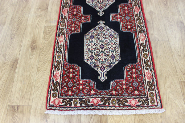 A traditional Persian Bidjar runner of traditional medallion design 247 x 56 cm