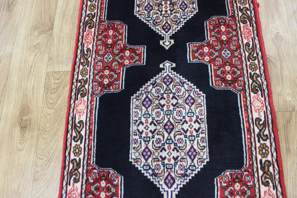 A traditional Persian Bidjar runner of traditional medallion design 247 x 56 cm