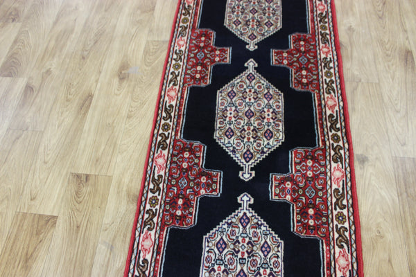 A traditional Persian Bidjar runner of traditional medallion design 247 x 56 cm