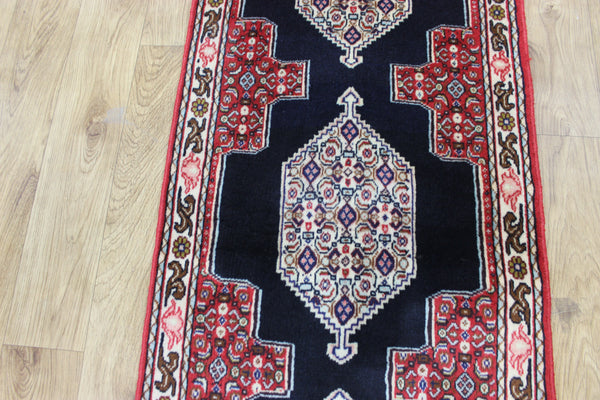 A traditional Persian Bidjar runner of traditional medallion design 247 x 56 cm