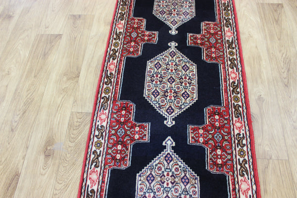 A traditional Persian Bidjar runner of traditional medallion design 247 x 56 cm