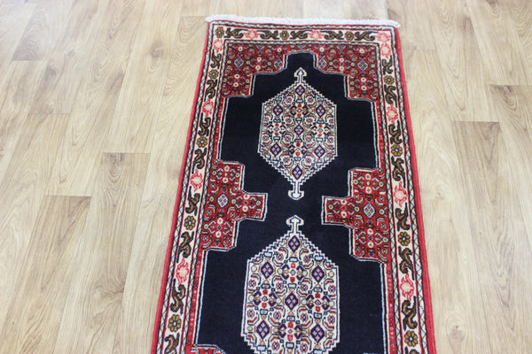 A traditional Persian Bidjar runner of traditional medallion design 247 x 56 cm