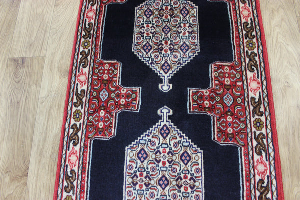 A traditional Persian Bidjar runner of traditional medallion design 247 x 56 cm
