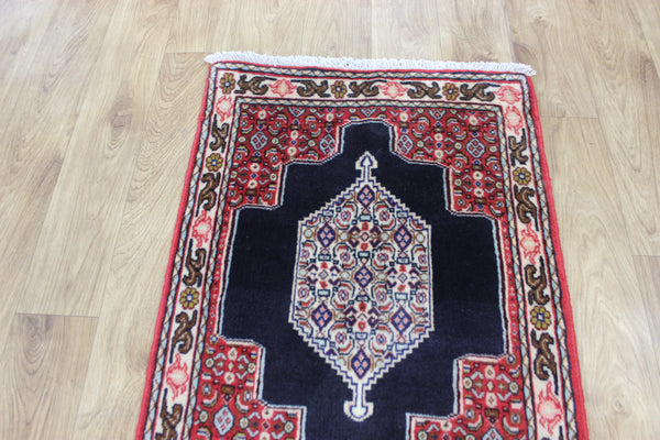 A traditional Persian Bidjar runner of traditional medallion design 247 x 56 cm