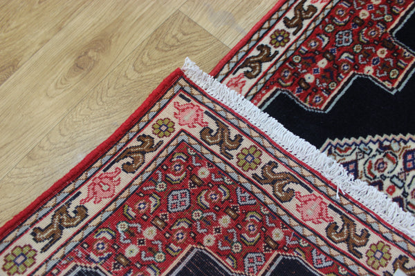 A traditional Persian Bidjar runner of traditional medallion design 247 x 56 cm
