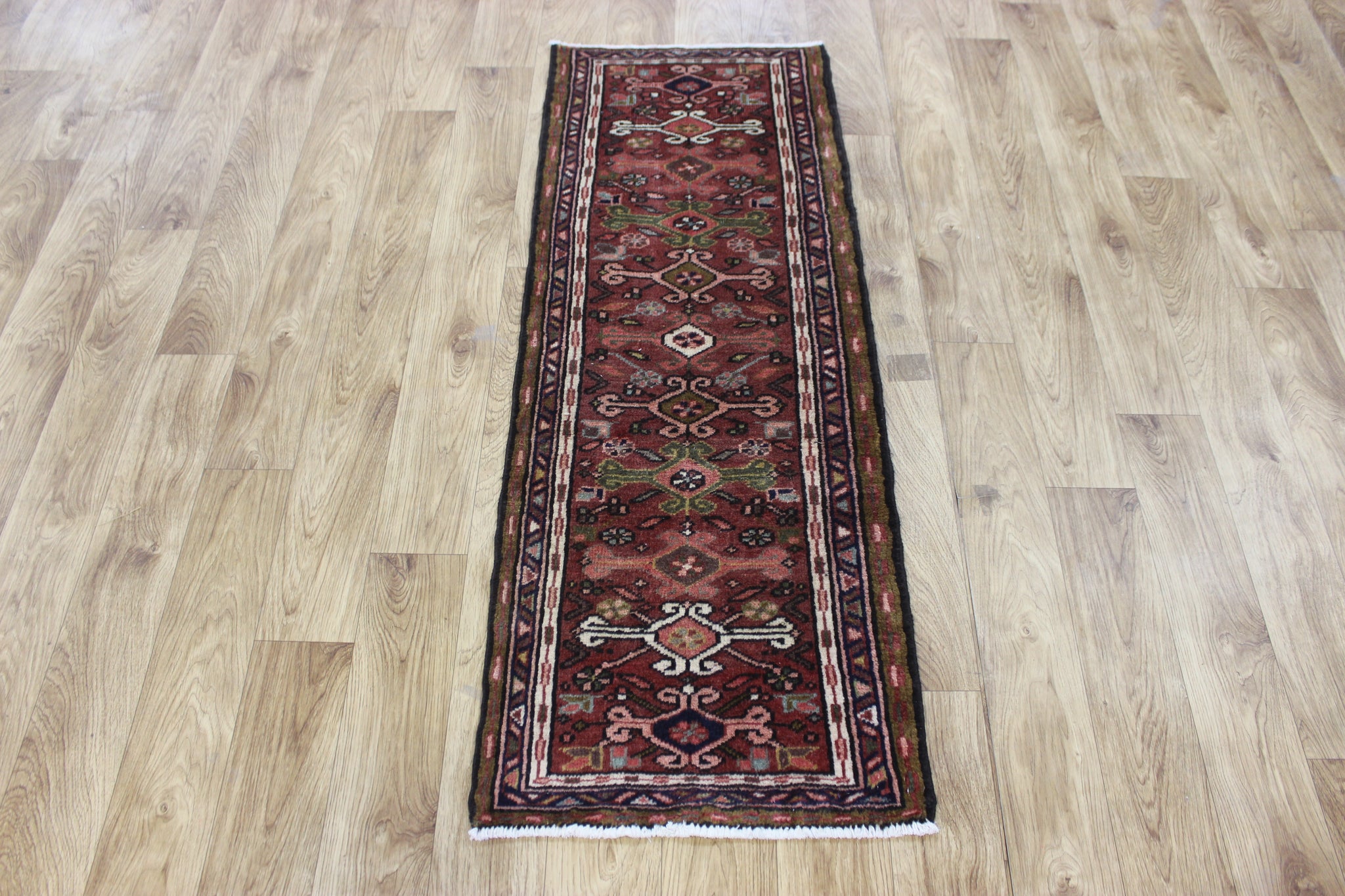 A good Persian Heriz runner of traditional design 140 x 50 cm