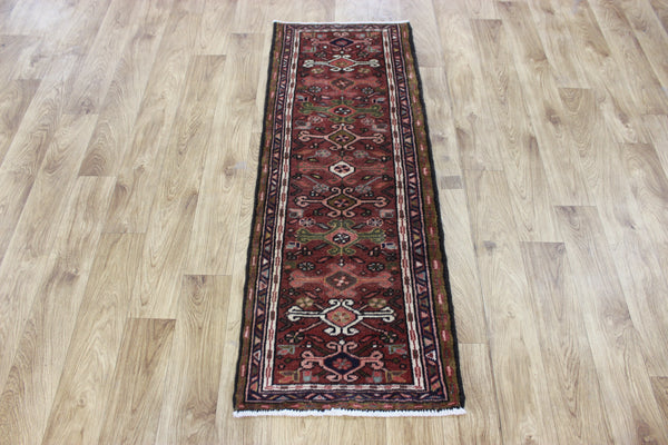 A good Persian Heriz runner of traditional design 140 x 50 cm