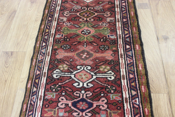 A good Persian Heriz runner of traditional design 140 x 50 cm
