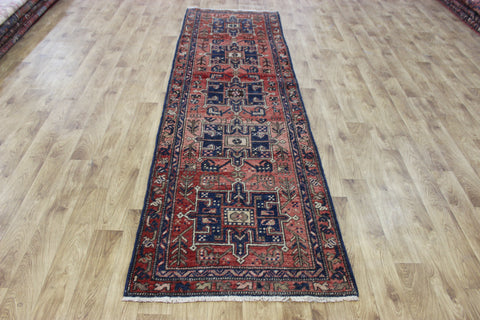 A good Persian runner with a design unique to the town of Heriz 284 X 86 CM