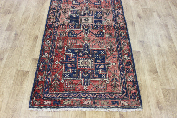 A good Persian runner with a design unique to the town of Heriz 284 X 86 CM