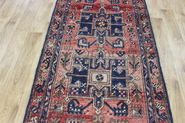 A good Persian runner with a design unique to the town of Heriz 284 X 86 CM