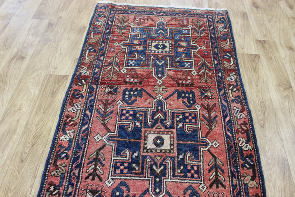 A good Persian runner with a design unique to the town of Heriz 284 X 86 CM