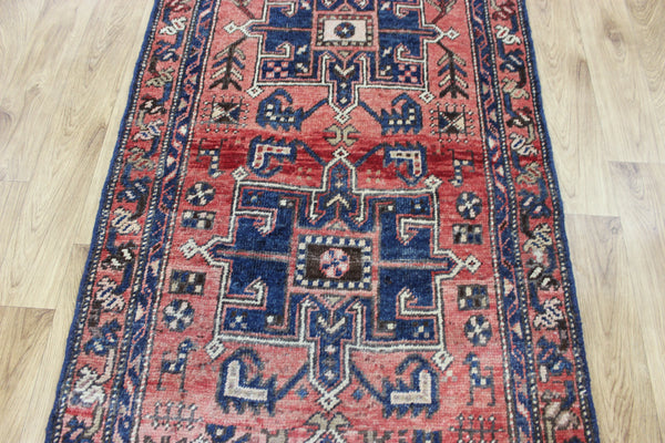 A good Persian runner with a design unique to the town of Heriz 284 X 86 CM