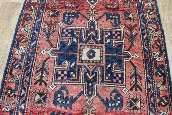 A good Persian runner with a design unique to the town of Heriz 284 X 86 CM