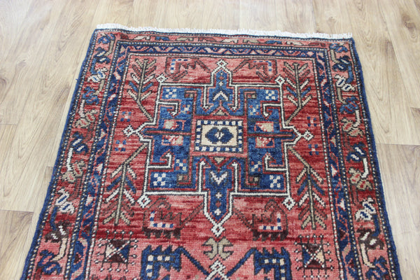 A good Persian runner with a design unique to the town of Heriz 284 X 86 CM