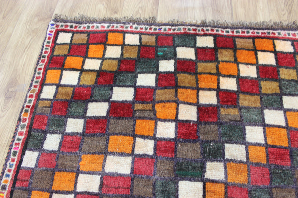 Vintage handmade Persian tribal rug with an all over checked design 175 x 105 cm