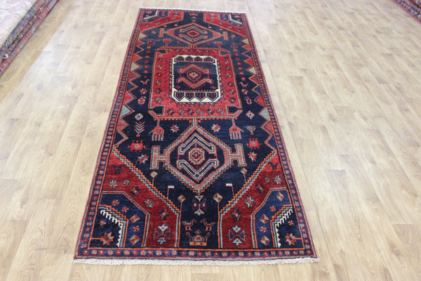 Old handmade Persian Hamadan region runner of traditional medallion design. Dated to the field 1349 (1976).