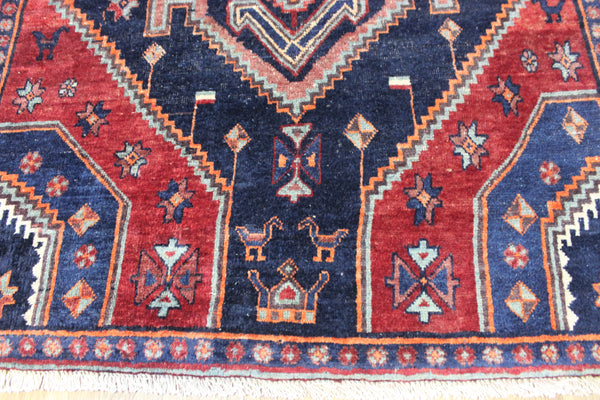 Old handmade Persian Hamadan region runner of traditional medallion design. Dated to the field 1349 (1976).