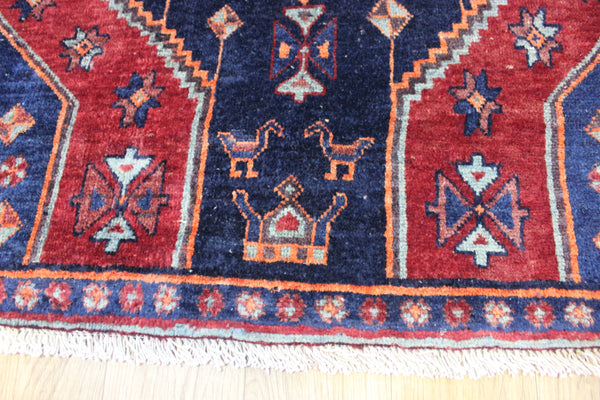 Old handmade Persian Hamadan region runner of traditional medallion design. Dated to the field 1349 (1976).