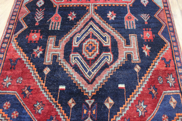 Old handmade Persian Hamadan region runner of traditional medallion design. Dated to the field 1349 (1976).