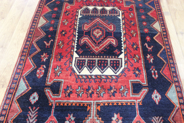 Old handmade Persian Hamadan region runner of traditional medallion design. Dated to the field 1349 (1976).