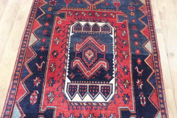 Old handmade Persian Hamadan region runner of traditional medallion design. Dated to the field 1349 (1976).