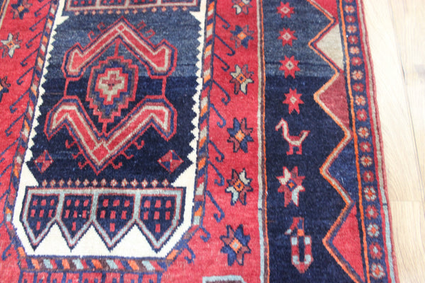 Old handmade Persian Hamadan region runner of traditional medallion design. Dated to the field 1349 (1976).
