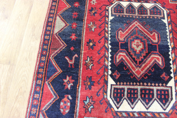 Old handmade Persian Hamadan region runner of traditional medallion design. Dated to the field 1349 (1976).