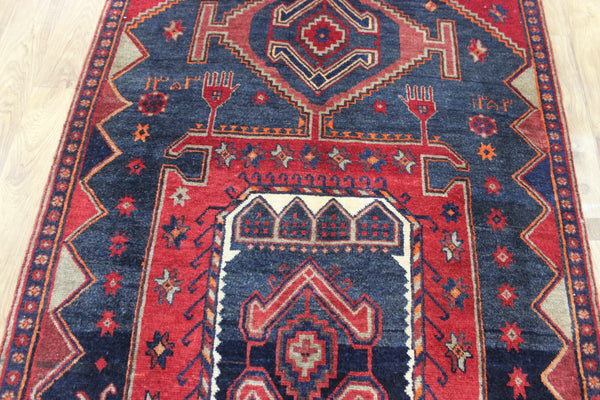Old handmade Persian Hamadan region runner of traditional medallion design. Dated to the field 1349 (1976).