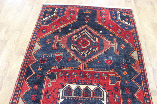 Old handmade Persian Hamadan region runner of traditional medallion design. Dated to the field 1349 (1976).