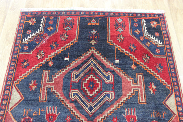 Old handmade Persian Hamadan region runner of traditional medallion design. Dated to the field 1349 (1976).