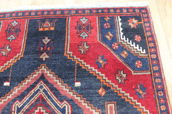 Old handmade Persian Hamadan region runner of traditional medallion design. Dated to the field 1349 (1976).
