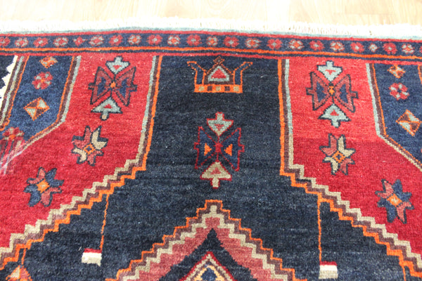Old handmade Persian Hamadan region runner of traditional medallion design. Dated to the field 1349 (1976).