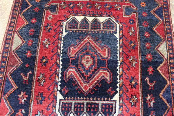 Old handmade Persian Hamadan region runner of traditional medallion design. Dated to the field 1349 (1976).