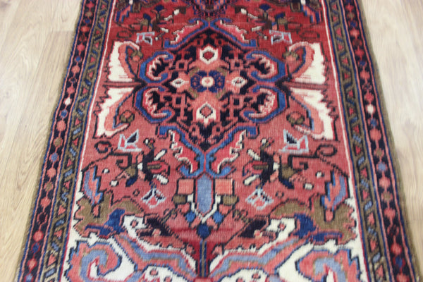 Persian Heriz runner of traditional medallion design 210 x 82 cm