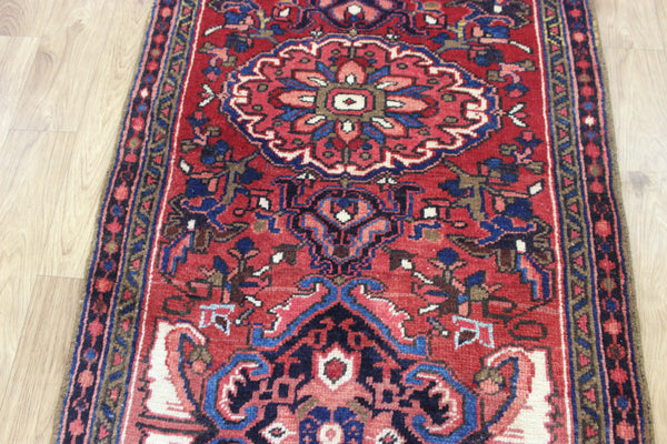 Persian Heriz runner of traditional medallion design 210 x 82 cm
