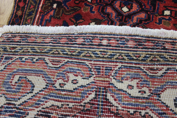Persian Heriz runner of traditional medallion design 210 x 82 cm