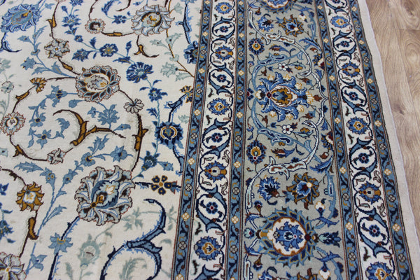 Signed Persian keshan carpet, of superb classic floral design with outstanding colours 443 x 294 cm