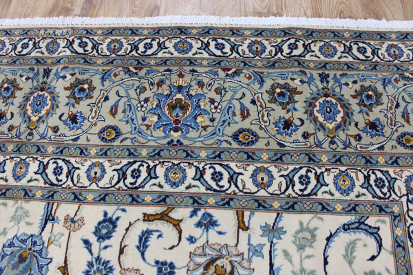 Signed Persian keshan carpet, of superb classic floral design with outstanding colours 443 x 294 cm