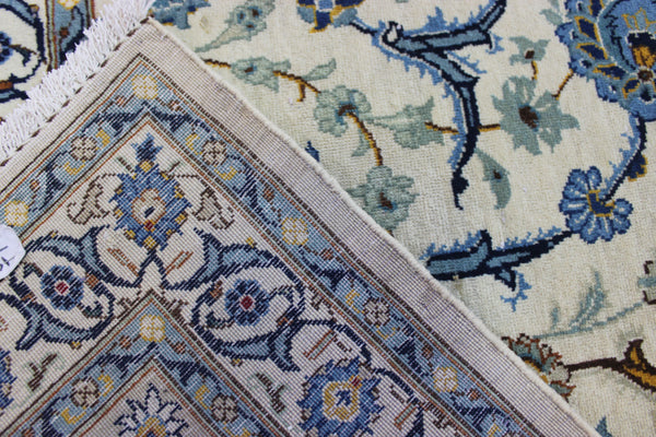 Signed Persian keshan carpet, of superb classic floral design with outstanding colours 443 x 294 cm