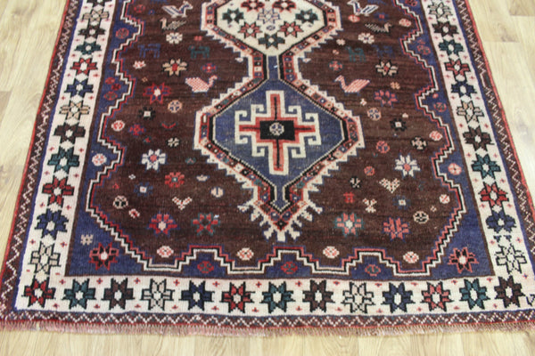 Vintage Persian Qashqai Shiraz Rug 200 × 140 cm – Brown Field Triple Medallion Tribal Design