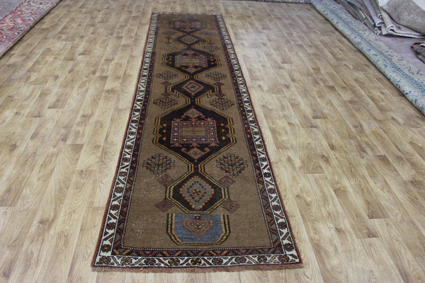 Antique Persian Heriz runner of traditional medallion design 390 x 95 cm