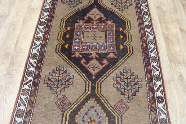 Antique Persian Heriz runner of traditional medallion design 390 x 95 cm